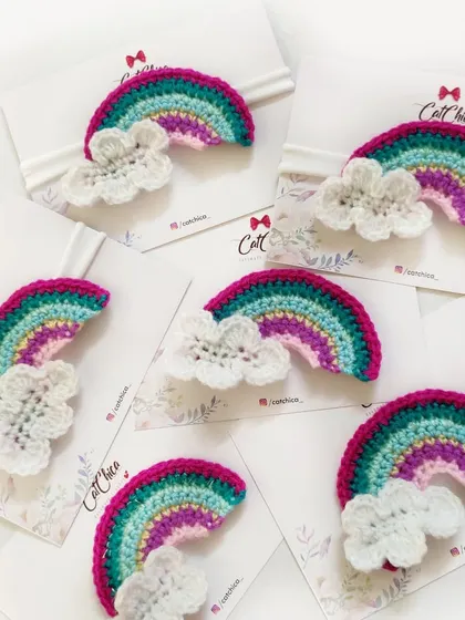 Our crochet rainbow headbands are perfect for newborns and toddlers. This design features a colorful rainbow with a fluffy white cloud on a soft band.
