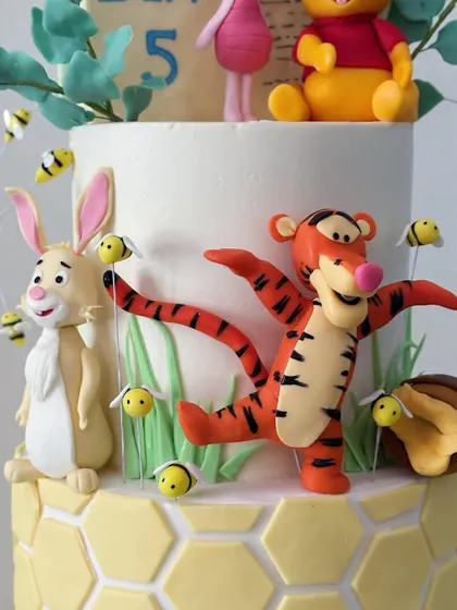 Tigger and Rabbit join the party! Each character is carefully placed to create a sense of fun and movement on the cake.