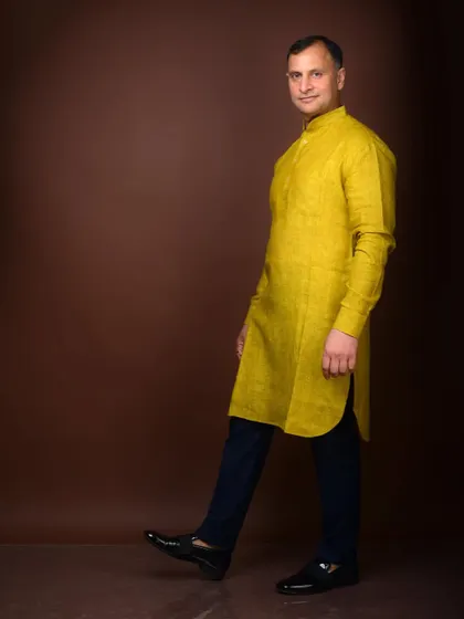 A walking pose for a politician's profile. This creates a sense of forward movement and action, suggesting a proactive and energetic leader.