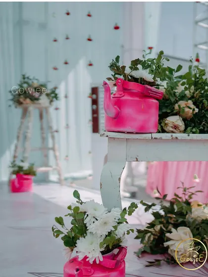More of the charming and rustic decor details, featuring painted kettles and white wooden furniture.