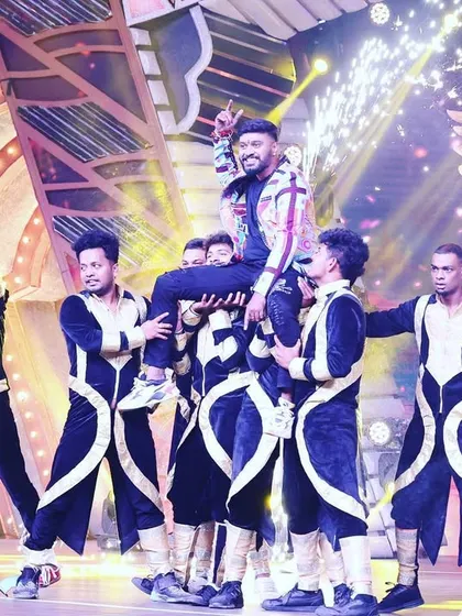 Being lifted by my talented dancers during my entry performance for 'Gichchi Giligili' Season 2. This shot captures the energy and teamwork that goes into our stage shows.