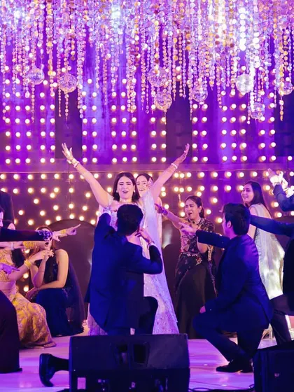 This epic final pose brings the groomsmen and bridesmaids together around the bride. I love choreographing big finale numbers that involve the whole wedding party for a memorable finish.