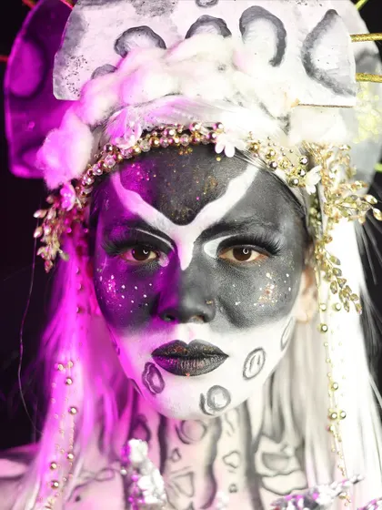 A powerful fantasy look inspired by the moon, with a stark black and white palette and celestial details.