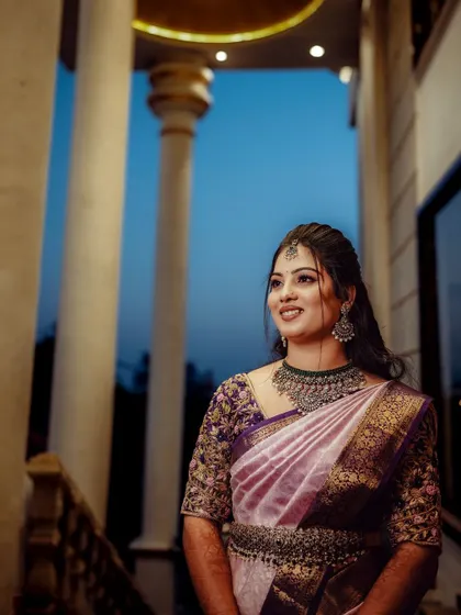 A beautiful outdoor shot of Chandana. The natural light highlights the glowing finish of her makeup and the lovely color of her saree.