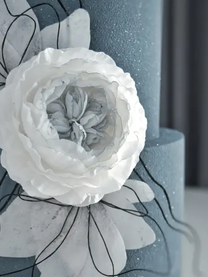 A detailed shot of the wafer paper flower, showing the delicate, layered petals.