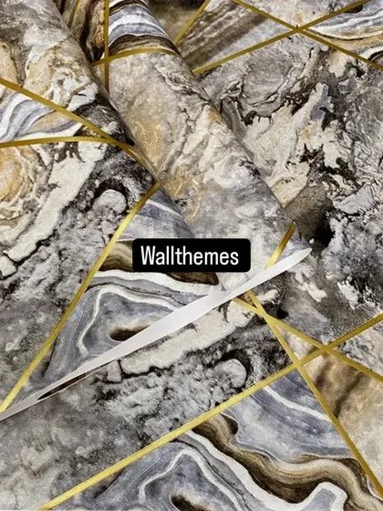 A close-up of a grey and beige marble-effect wallpaper with intersecting gold lines, showing the intricate details.