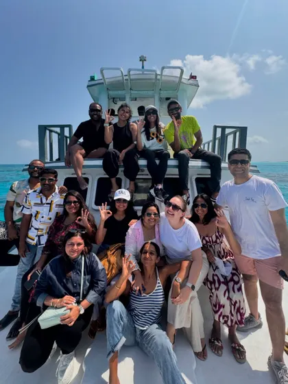Our happy crew after a day of exploring the islands by boat. The bonds we form on these trips are just as important as the yoga and diving.