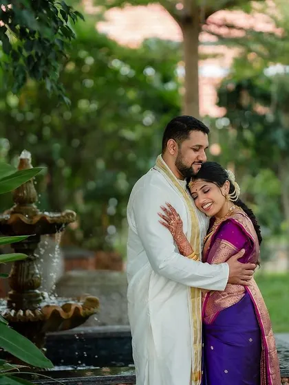 A romantic stroll in the rain. We embrace every element of the wedding day, even a little monsoon magic, to create unique and memorable couple portraits.