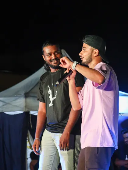 Interacting with a fellow trainer on stage. We believe in creating a collaborative and supportive environment at our events.