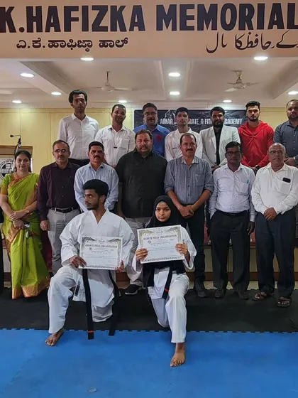 The community comes together to honor the hard work of our students. This group photo captures the support system behind every black belt.