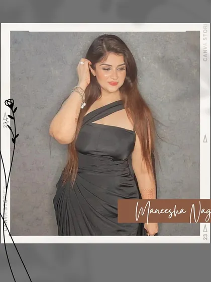 The one-shoulder drape of the black saree, a classic and elegant look.