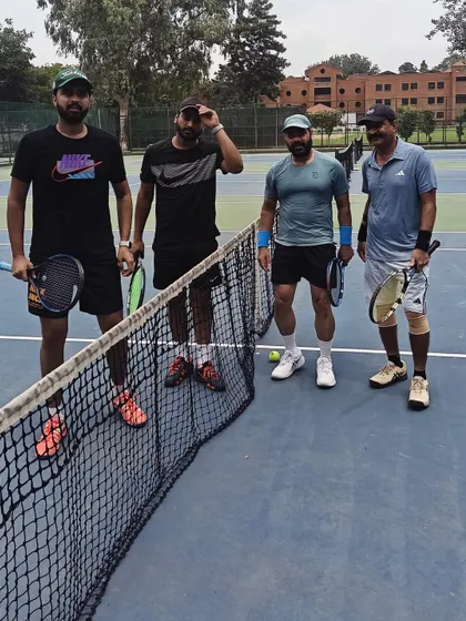 A group of our Masters players ready for a doubles match. Our community brings together players of all levels who share a love for the game.