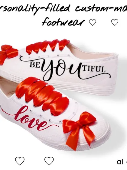 These "Be-you-tiful" custom shoes are all about self-love and positivity. The simple typography and bright red ribbon laces make for a chic and inspiring design on a classic white sneaker.