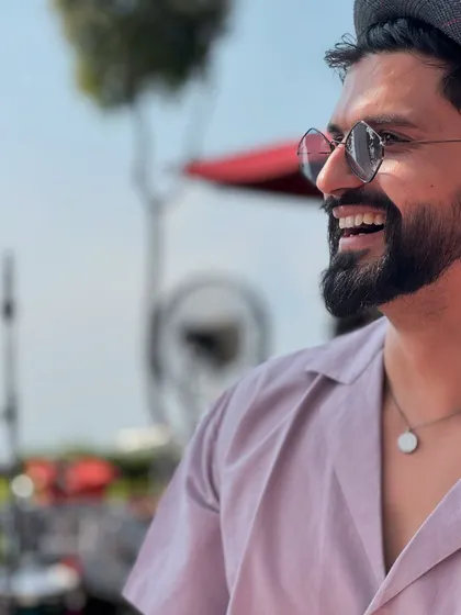 A simple smile is the best accessory. A close-up shot that feels warm and personable.