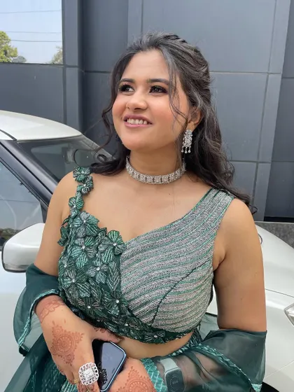 A happy and confident client, looking beautiful in her unique outfit and makeup.