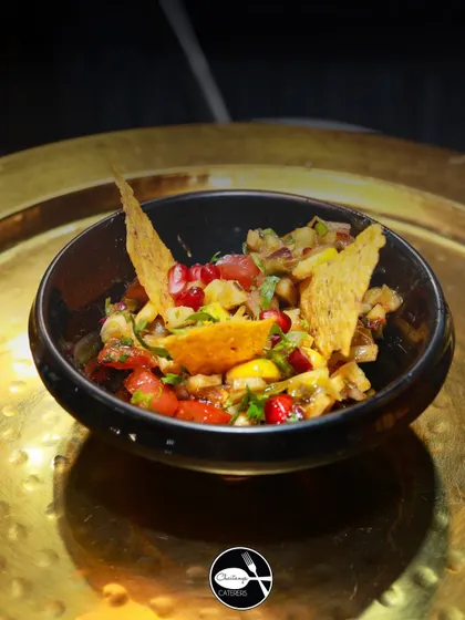 I love creating fusion dishes, like this Khasta Nacho Chaat. It combines the crunch of Mexican nacho chips with the tangy and spicy flavors of Indian chaat for a truly unique appetizer.