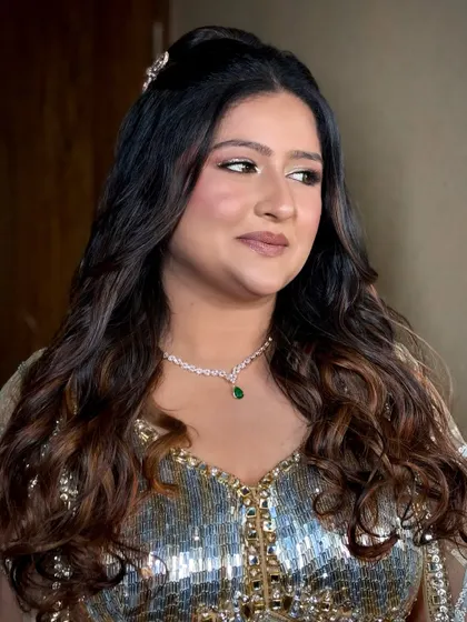 A glamorous sangeet look with shimmery silver eyeshadow and a nude lip, perfect for a night of dancing.