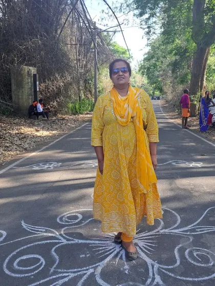 Standing on a road decorated with rangoli during the Soliga festival. These travels are a constant source of learning and inspiration.