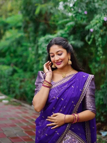 A candid moment in a beautiful purple patola print Langa Davani. The soft fabric and elegant design make it a comfortable yet stylish option.