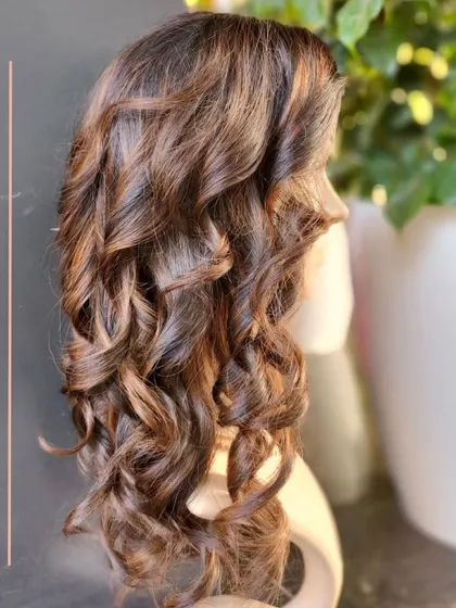 This is our cap base wig in a molten honey color. It's 14 inches long with low density for a very natural, wearable look.