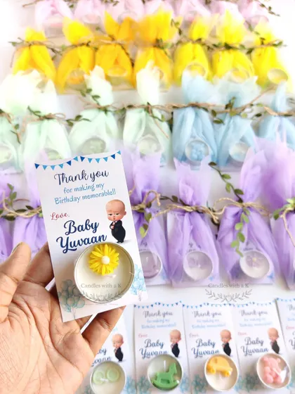 Holding one of the unique tealight favors, which includes a custom-designed thank you card that doubles as a bookmark.