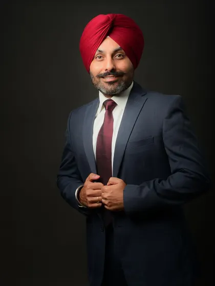 Adjusting the jacket is a classic pose that adds a touch of style and preparation to a corporate portrait.
