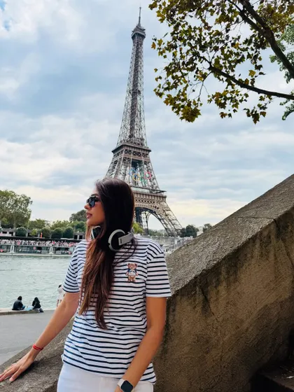 A candid moment in Paris, with my headphones always close by. Music is a constant companion, whether I'm on stage or exploring a new city.