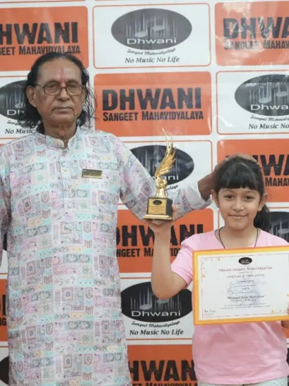 A senior guru with one of his young, talented students.