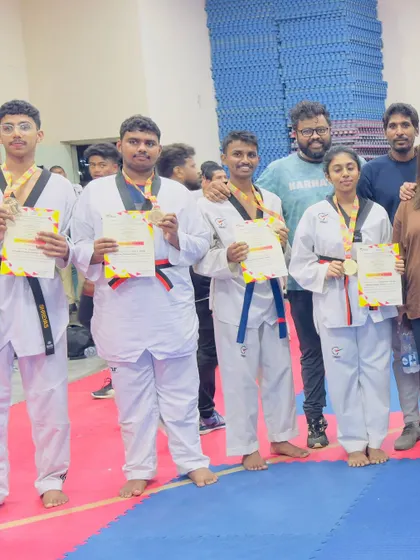 Our students proudly display their medals and certificates after the state championship. The joy of achievement is a powerful motivator for our entire Taekwondo family.