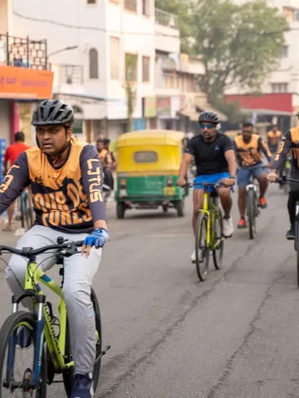 A group of cyclists riding together, demonstrating the community spirit of our cycling events.