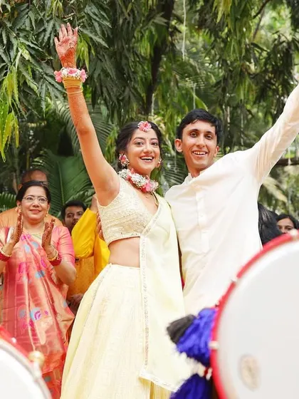 Dancing to the beat of the dhol! We capture the high energy and celebratory mood as the couple makes their entrance.