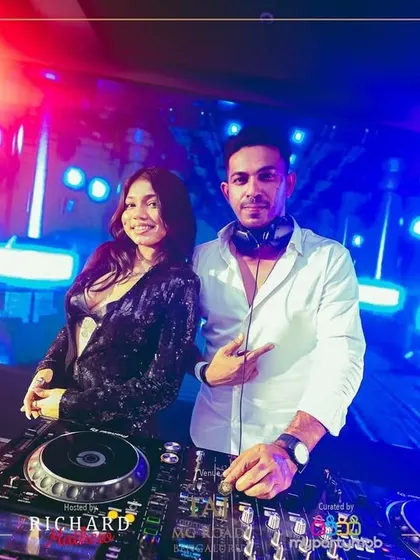 Another great shot with my co-DJ for the NYE party, with a stunning light show in the background.
