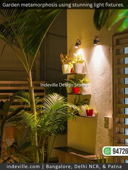 A garden corner transformed with ambient lighting. The spotlights highlight the texture of the plants and create a dramatic effect, turning the space into a beautiful feature after dark.