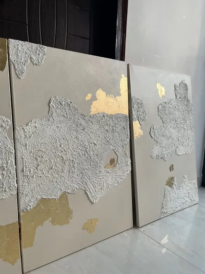 A set of four 3ft x 2ft canvases for a Mumbai home. This series features abstract islands of heavy texture on a neutral background, with accents of 24ct gold leaf peeking through.