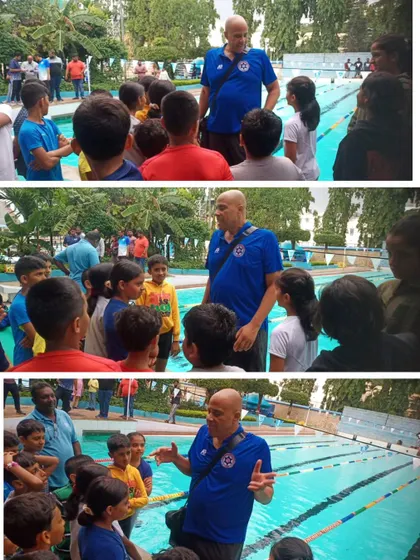 National Program Director for SFI, Coach Chris Martin, mentoring our budding swimmers.