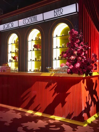 The Art Deco-inspired bar we designed for the theatre-themed Sangeet. Every detail, from the lighting to the floral arrangements, was curated to immerse guests in the glamorous, cinematic atmosphere.