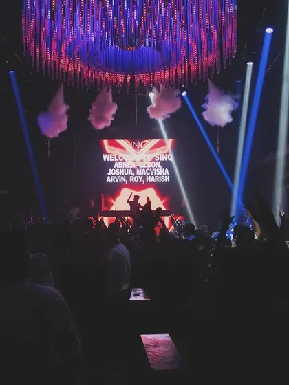 A wide shot of the stage at SinQ during a corporate event.