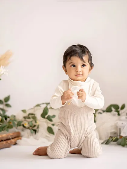 A duplicate of the happy baby in the minimalist boho setup.