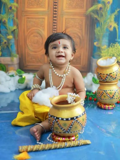 A happy little Krishna with his pot of butter. The genuine smiles and giggles are what make these sessions so special and the memories so dear.