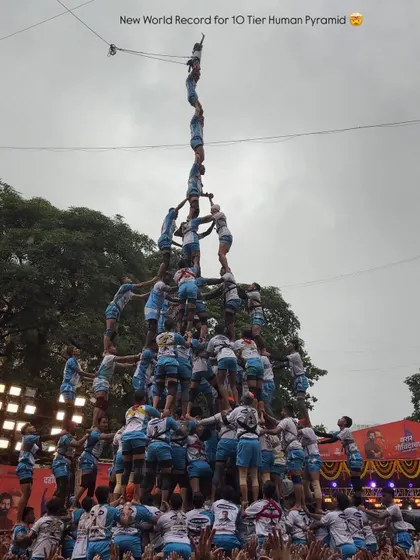 Freezing a moment of pure adrenaline and teamwork. This shot captures a Govinda pathak creating a 10-tier human pyramid during Dahi Handi, a testament to the spirit and strength I focus on documenting.