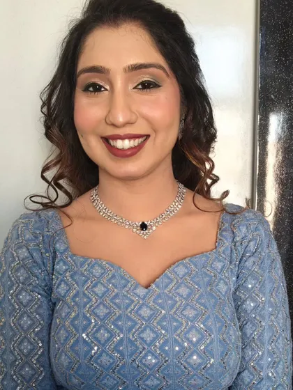 A classic HD makeup look for a party. The sharp winged liner and bold red lip are a timeless combination.