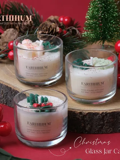A beautifully styled shot of the 'Christmas in a Jar' candle set.