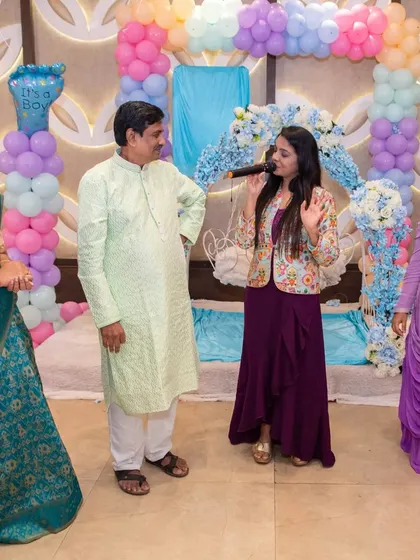 Engaging with the grandparents during Parv's naming ceremony. Their joy and blessings are the most important part of these traditional family gatherings.