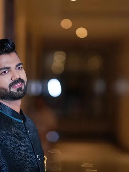 A close-up of the engagement look. The hairstyle is sharp, and the beard is perfectly groomed to complement the outfit.