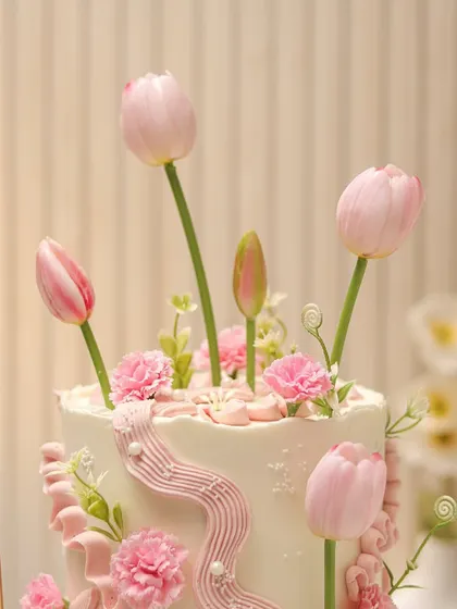 Another angle of the pink tulip cake, showing the arrangement and delicate piping details.