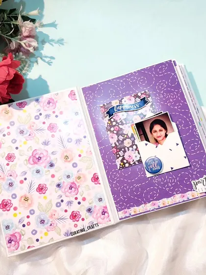 An inside page of the friend scrapbook, with floral patterns and a spot for a single photo.