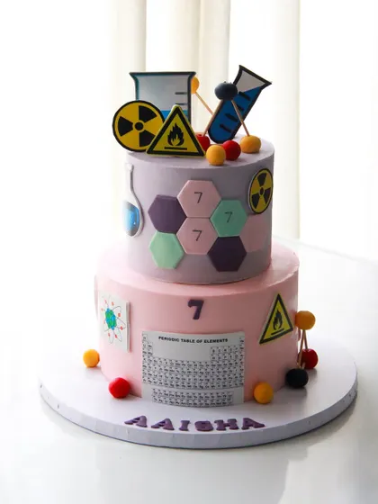 The full view of the science cake for Aaisha, combining learning and fun in a sweet creation.