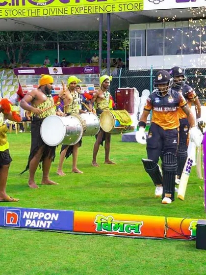 Drummers create a vibrant atmosphere for a player's entrance at the Karnataka Premier League (KPL). We incorporate local culture and high-energy entertainment into our regional league productions.