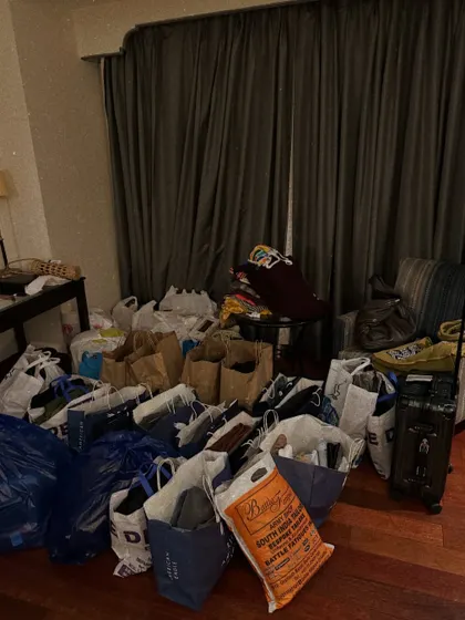A real, unfiltered look at my workspace during a major project. This is what a "wardrobe dump" looks like after sourcing for a multi-event wedding.