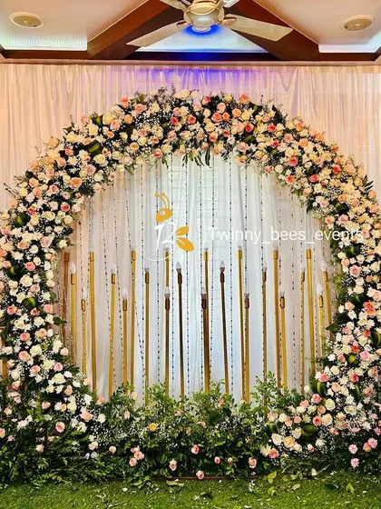 For a grand and lush feel, we created this full circular arch made entirely of fresh pink and white roses. This floral-heavy design works beautifully as a main stage backdrop for a baby shower or naming ceremony in any venue.